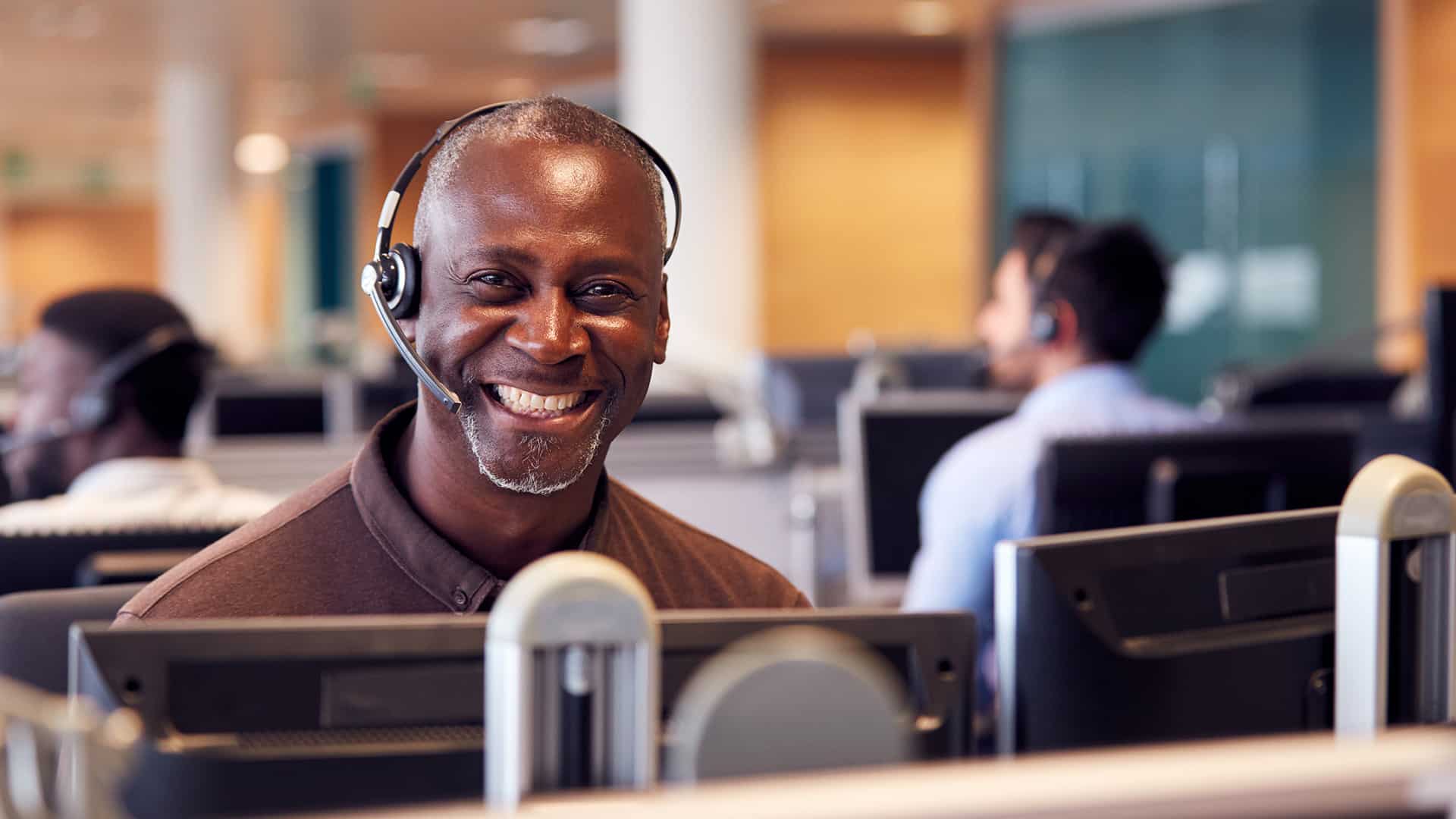 call center customer service representative smiling on the phone